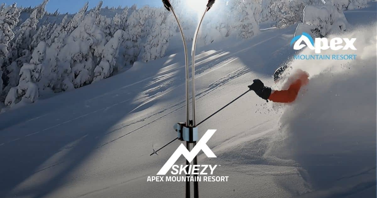 Apex Mountain Resort background featuring skier, Skiezy Performance Ski Strap in use, Skiezy logo, and resort logo shown