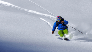 intense man skiing powder