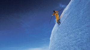 john eaves skiing steep cliff